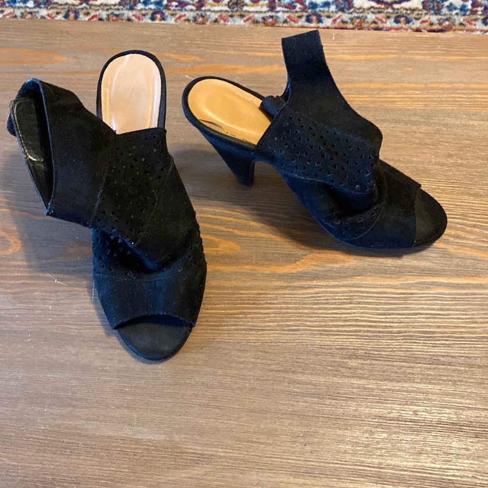 Black Velcro heels. Slight wear.